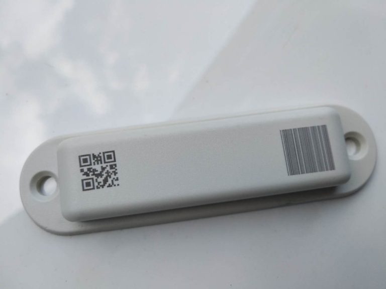 Black marking on white plastic